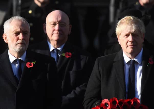 Labour party leader Jeremy Corbyn (left) and Prime Minister Boris Johnson during the Remembrance Sunday service at the Cenotaph memorial in Whitehall, central London