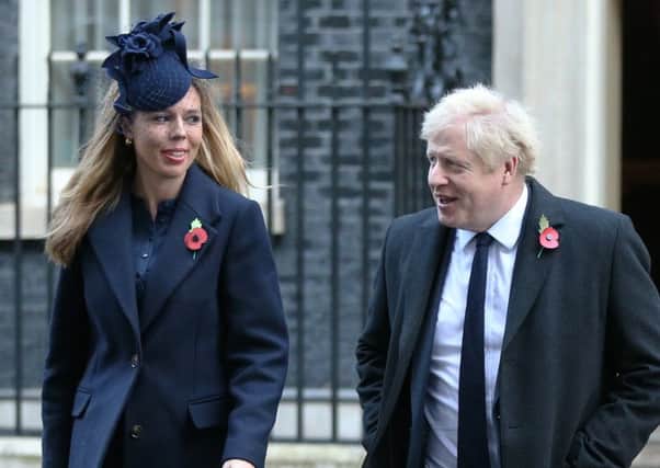 Boris Johnson, with partner Carrie Symonds in Downing Street yesterday, published his Withdrawal Deal last month
