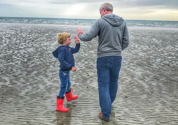 Jonny McCambridge with his son James on Tyrella Beach