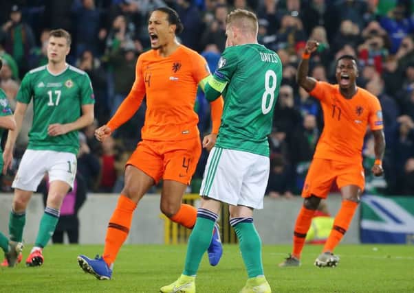 Holland players celebrates following Steven Davis' penalty miss on Saturday for Northern Ireland. Pic by PressEye Ltd.
