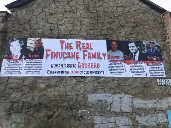 A banner targeting Sinn Fein election candidate John Finucane and his family, which was erected on a building in Mayo Street of Shankill Road in Belfast
