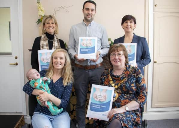 Back row, Juliet Coulter, Principal Environmental Health officer, John Robb, Community Health and Wellbeing advisor and father of Eli and Rhonda McIlroy, registrar; front row, Emma Robb, baby Eli and the Mayor of Mid and East Antrim, Cllr Maureen Morrow.