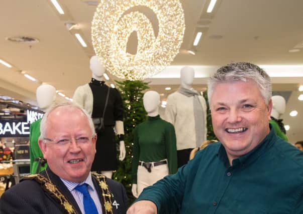 Mayor of Antrim and Newtownabbey Borough Council, Ald John Smyth alongside M&S Abbey Centre Store Manager, Colin McGreevy.