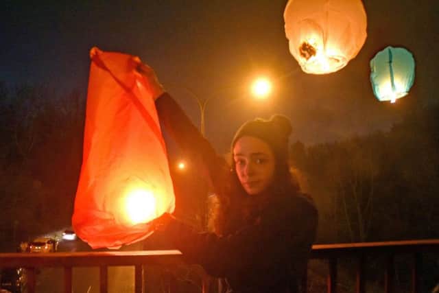 Joanna Black releases a Chinese Lantern in memory of her fiancee Nathan Gibson