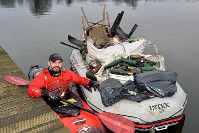 Jon Medlow in his kayak with just some of the rubbish he has collected from the River Bann
