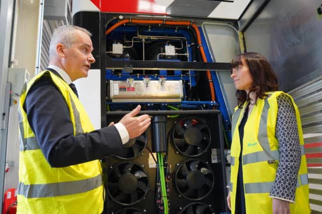 Infrastructure Minister Nichola Mallon is shown around the latest hydrogen bus prototype by Translink Group Chief Executive Chris Conway.