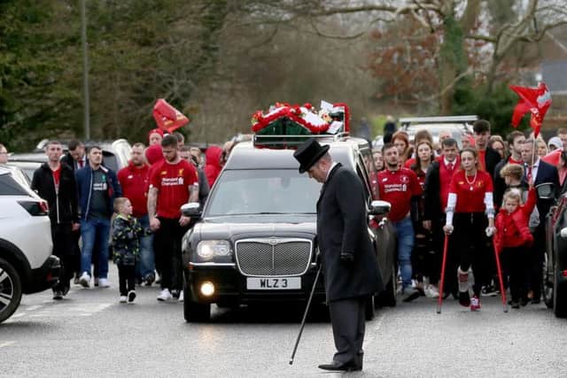 Funeral of Nathan Gibson, leaving Westacres, Craigavon, today. Nathan's body was discovered on a towpath near Lake Road in Craigavon by police on Thursday, January 16. Mourners were asked to wear red in tribute to Nathan's love for the Liverpool.  Photo Laura Davison/Pacemaker Press