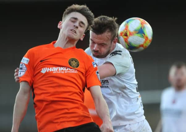 Cameron Dummigan (right) competing for Crusaders against Carrick Rangers on his weekend debut. Pic by Pacemaker.
