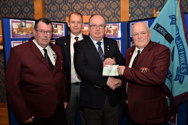 Alan Rice, chairman of the Larne & District Great War Society and Paul Duffin, secretary, present a cheque for £1000 to Michael O`Toole, Wings Appeal organiser of the Royal Air Forces Association, Larne Branch and James Filbey, vice chairman of the RAFA Larne Branch. INLT 08-005-PSB