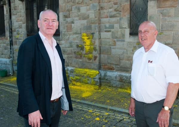 The Apprentice Boys' Memorial Hall in Londonderry has been attacked for the third night running.  Pictured at the hall Mark Durkan MP and Philip Gillen (Apprentice Boy)