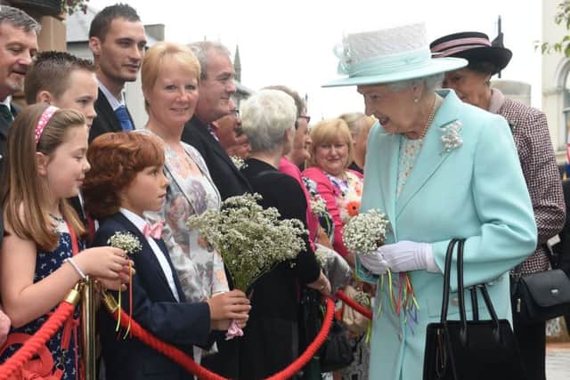 Queen Elizabeth II meeting members of the public during a wreath laying ceremony marking the centenary of the First World War at Coleraine Town Hall