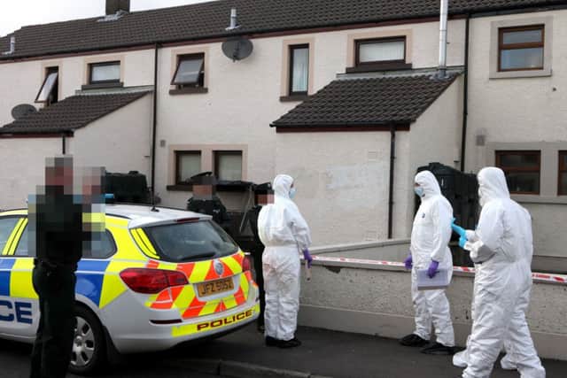 Forensic investigators at the scene of the killing in Ballycastle