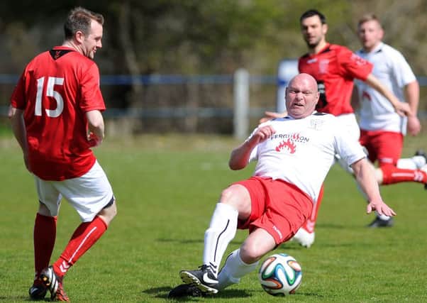 Former Linfield manager David Jeffrey in action for Belfast Swifts in the charity match against a Larne Select team