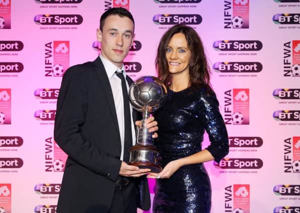 Paul Heatley receives his BT Sport Footballer of the Year award from Angela Rogan of BT Sport