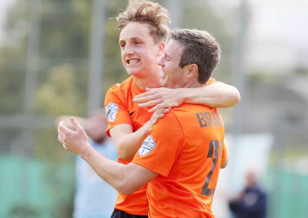 Joel Cooper and Kevin Braniff celebrate the first goal.