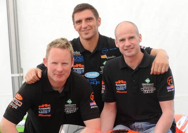 Sandor Bitter (centre) with his KMR Kawasaki team-mates Adrian Archibald (left) and Ryan Farquhar at the Cookstown 100 in 2011