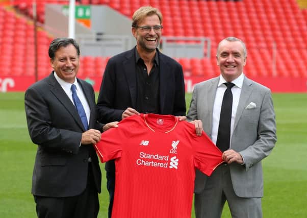 New Liverpool manager Jurgen Klopp (centre) with CEO Ian Ayre (right) and Tom Werner (left)