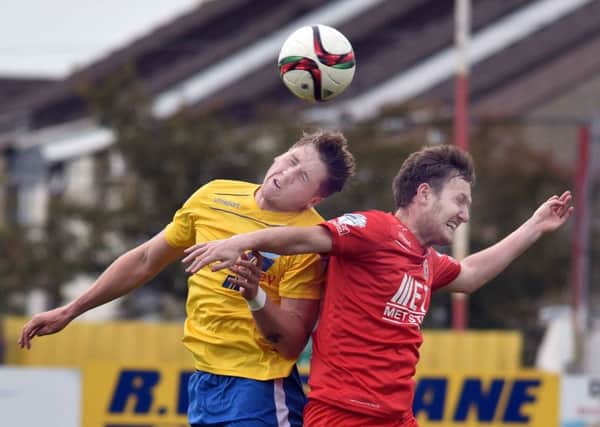 Portadown's Gary Twigg 
and Ballymena's Gareth Rodger 
during Saturday's match at Shamrock Park. Picture: Press Eye.