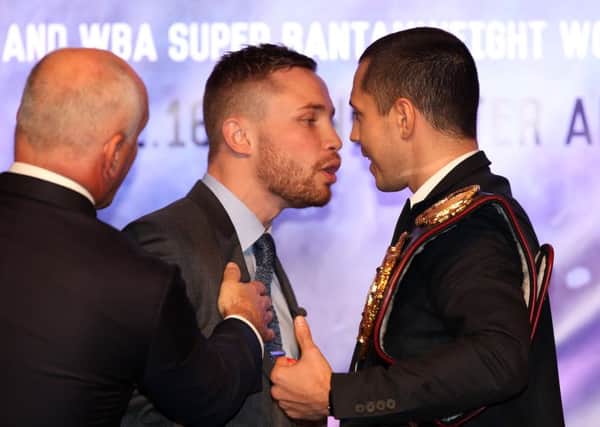 Barry McGuigan holds back Carl Frampton at yesterdays press conference