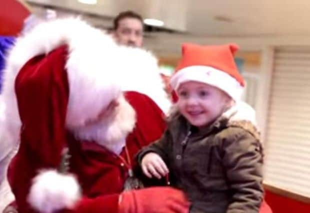 Santa Claus at the Cleveland Centre, Middlesborough, speaks to a little girl in sign language. Picture: MashupMark on YouTube
