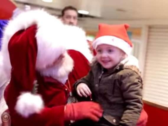 Santa Claus at the Cleveland Centre, Middlesborough, speaks to a little girl in sign language. Picture: MashupMark on YouTube