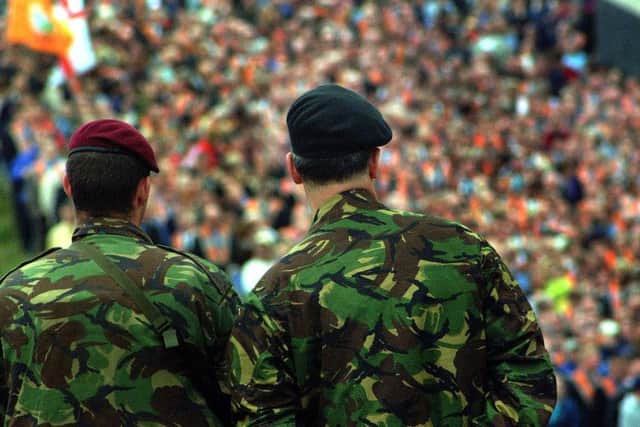 The church and its surrounds have long been the scene of protest around Orange marches. Pictured here are soldiers during a 2001 gathering.
