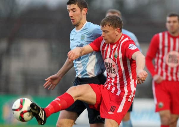 Ballymena United's Gary Thompson tussles for possession with Warrenpoint Town's Liam Bagnall during today's Danske Bank Premiership match at the Showgrounds. Picture: Press Eye.
