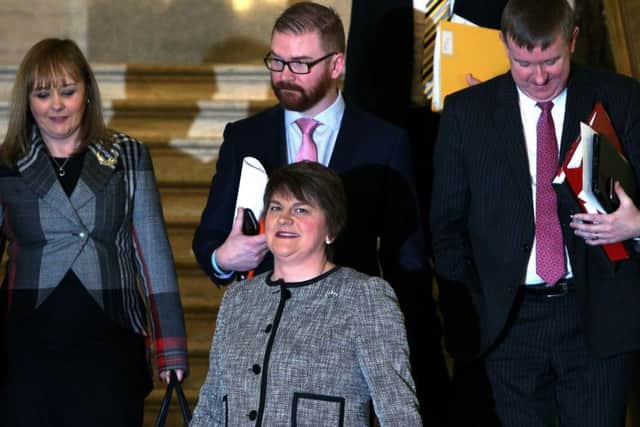 Arlene Foster arrives with her team in the Great Hall in Parliament Buildings as the 45-year-old from Co Fermanagh becomes the first woman to lead Northern Ireland's powersharing Executive today. Photo: Brian Lawless/PA Wire