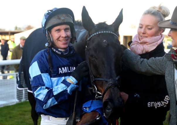 Richard Johnson poses with Garde La Victoire after winning The Racing UK Winter Season Ticket Novices' Steeple Chase at Ludlow