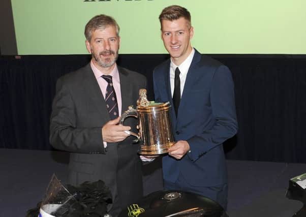 Ian Hutchinson has received the prestigious Torrens Trophy in recognition of his return to winning ways at the Isle of Man TT after serious injury.