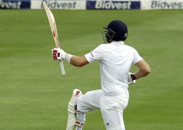 England's batsman Joe Root, jumps as he celebrates his century on the second day of the third test cricket match between South Africa and England