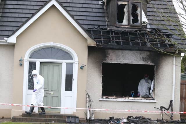 13 January 2015 McAuley Multimedia Police and NIFRS forsenic officers examine the scene where a woman was rescued from a fire at Woodcroft Brae in Ballymena. She is critical in hospital and it is understood the fire was caused by accidental ignition. PICTURE STEVEN MCAULEY/MCAULEY MULTIMEDIA