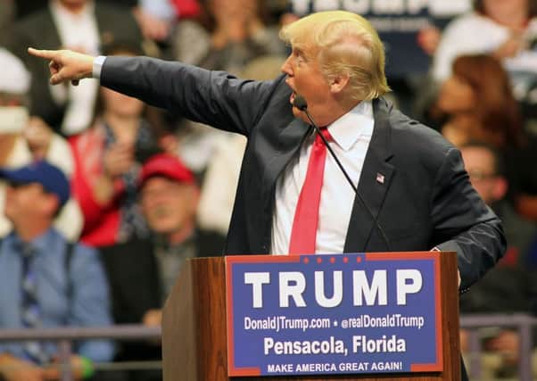 Republican presidential candidate Donald Trump points to the audience as he speaks during a campaign rally at the Pensacola Bay Center in Pensacola, Fla., in January. (AP Photo/Michael Snyder)