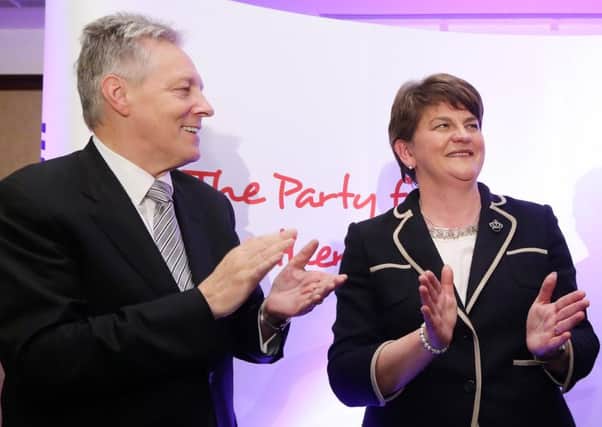 Arlene Foster, right, has been full of praise for her predecessor as DUP leader, Peter Robinson, left, but has nonetheless adopted a different leadership style in her opening days in the top jobs.

Picture by Kelvin Boyes  / Press Eye