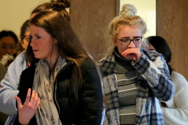 Tearful friends arrive at Assumption College in Ballynahinch on Sunday where a service was held for tragic pupil Ellen Finnegan