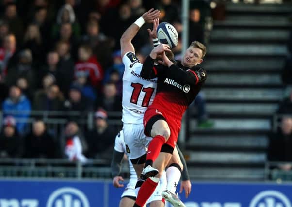 Craig Gilroy of Ulster wins the battle for a high ball with Chris Ashton of Saracens