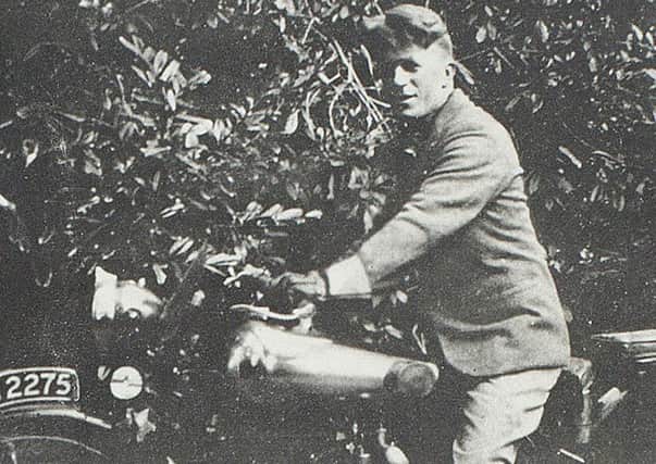 T E Lawrence sitting on the motorbike on which he would be killed in May 1935