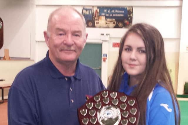 Rod Coleman presenting the North West Captain Shauna O'Neill with the Junior Match play shield.
