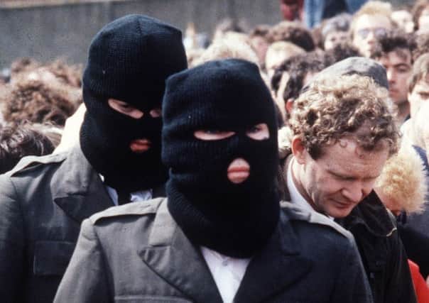 IRA members at a funeral in 1985, attended by Martin McGuinness.