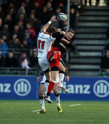 Craig Gilroy of Ulster wins the battle for a high ball with Chris Ashton of Saracens