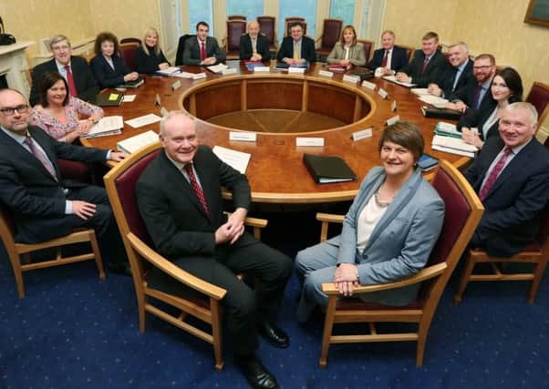 Martin McGuinness, pictured at Thursday's meeting of the Executive with new First Minister Arlene Foster, has said he would consider an invitation from the Orange Order to attend the Twelfth
