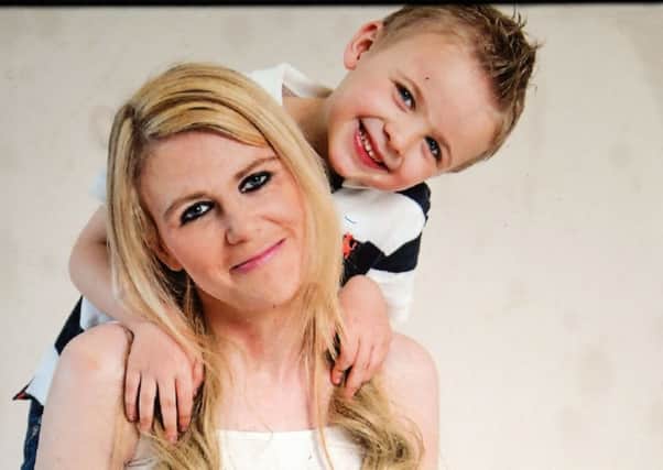 Six-year-old Joshua Kelly with his mum Clare