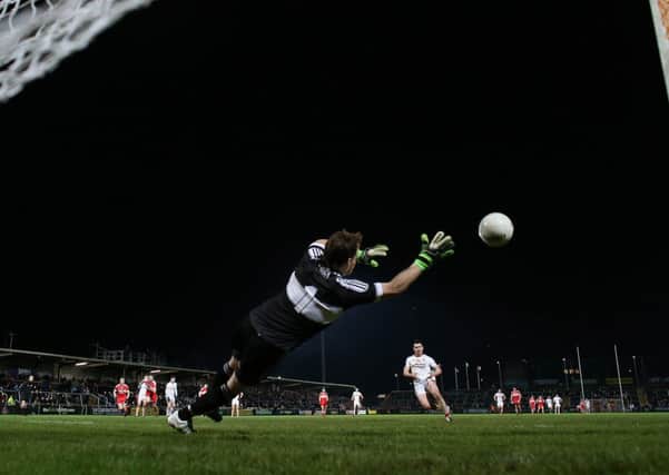 Derry goalkeeper Thomas Mallon fails to save a penalty from Tyrone's Darren McCurry