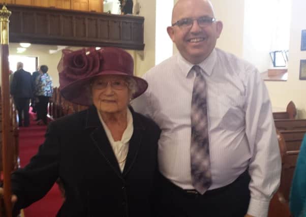 Mrs Mollie Holmes pictured with DUP alderman John Finlay