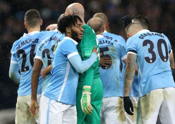 Manchester City's Raheem Sterling celebrates with his team-mates after the Capital One Cup, semi final