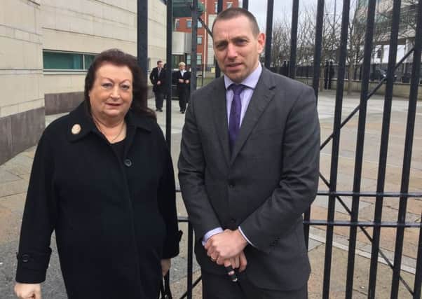 Patrick McVeigh's daughter Patricia and her solicitor Padraig O Muirigh outside Belfast Laganside Courts