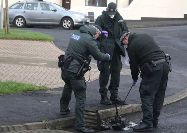 Police and forensic officers at the Murder scene in Broombeg View, Ballycastle, on January 28
