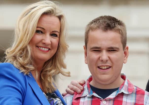 Jo-Anne Dobson MLA, who proposed the opt-out system, with her son Mark who received a donated organ