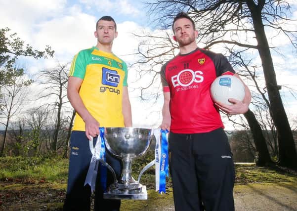 Donegal's Frank McGlynn and Down's Mark Poland