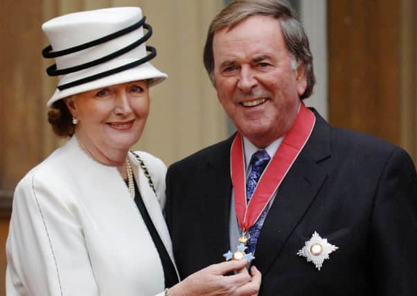 Sir Terry Wogan and wife Helen after he received his knighthood in 2005